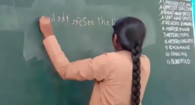 Bé gái 16 tuổi viết 40 từ trong 1 phút bằng cả hai tay