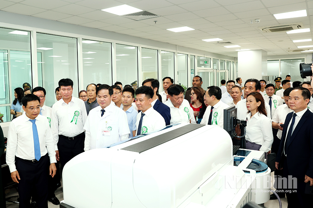 Delegates visit a room at the new campus.